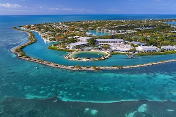 Private beach, sun loungers, beach umbrellas, beach towels at Hawks Cay Resort
