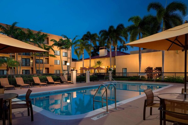 Outdoor pool, open 6:00 AM to 11:00 PM, pool umbrellas, sun loungers
