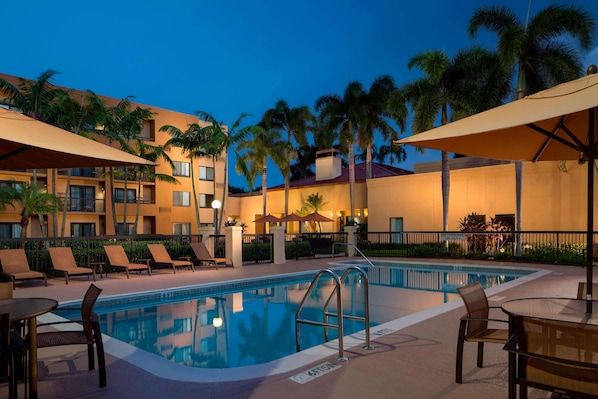 Outdoor pool, open 6:00 AM to 11:00 PM, pool umbrellas, sun loungers