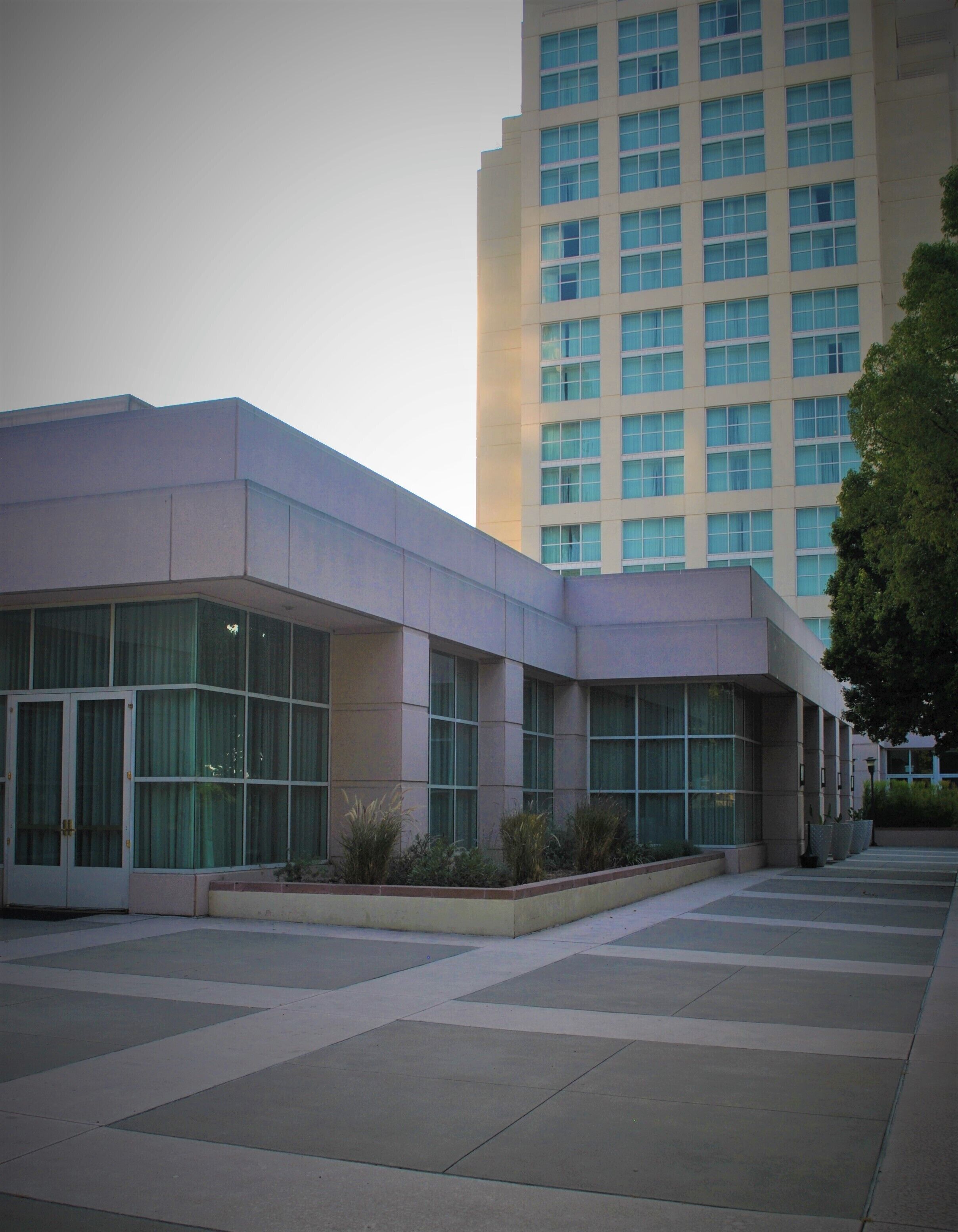 A modern building with large windows and a flat roof.