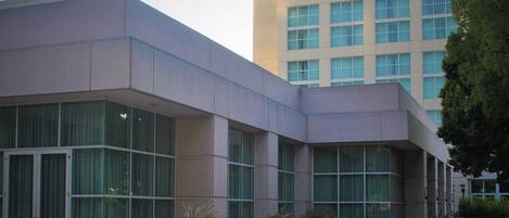 A modern building with large windows and a flat roof.