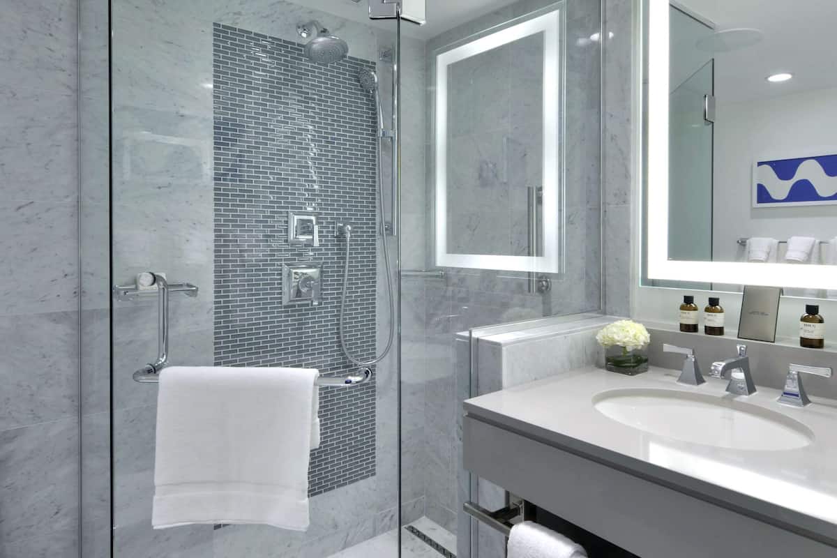 Shower, designer toiletries, hair dryer, bathrobes