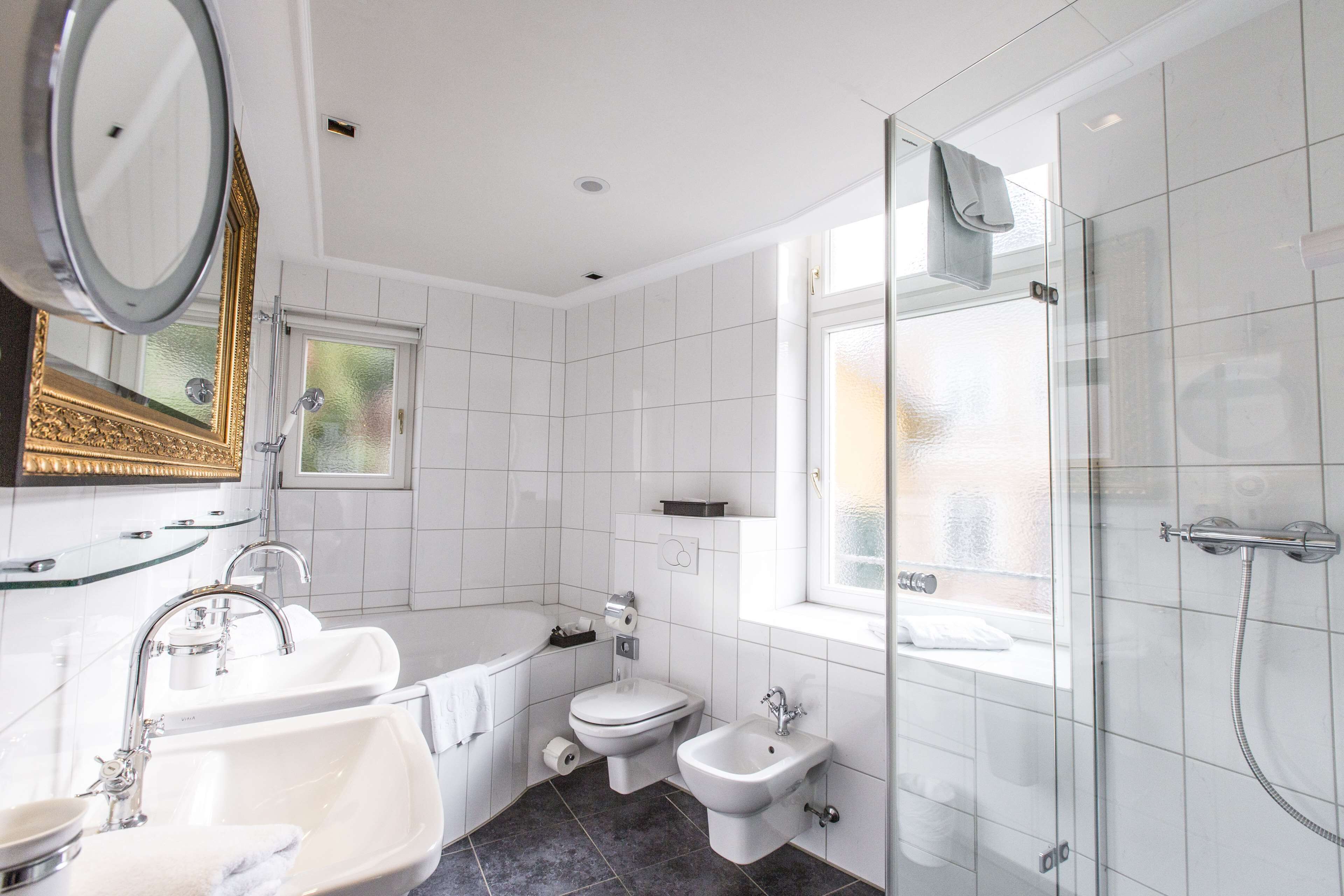 junior suite | bathroom | shower, hair dryer, towels