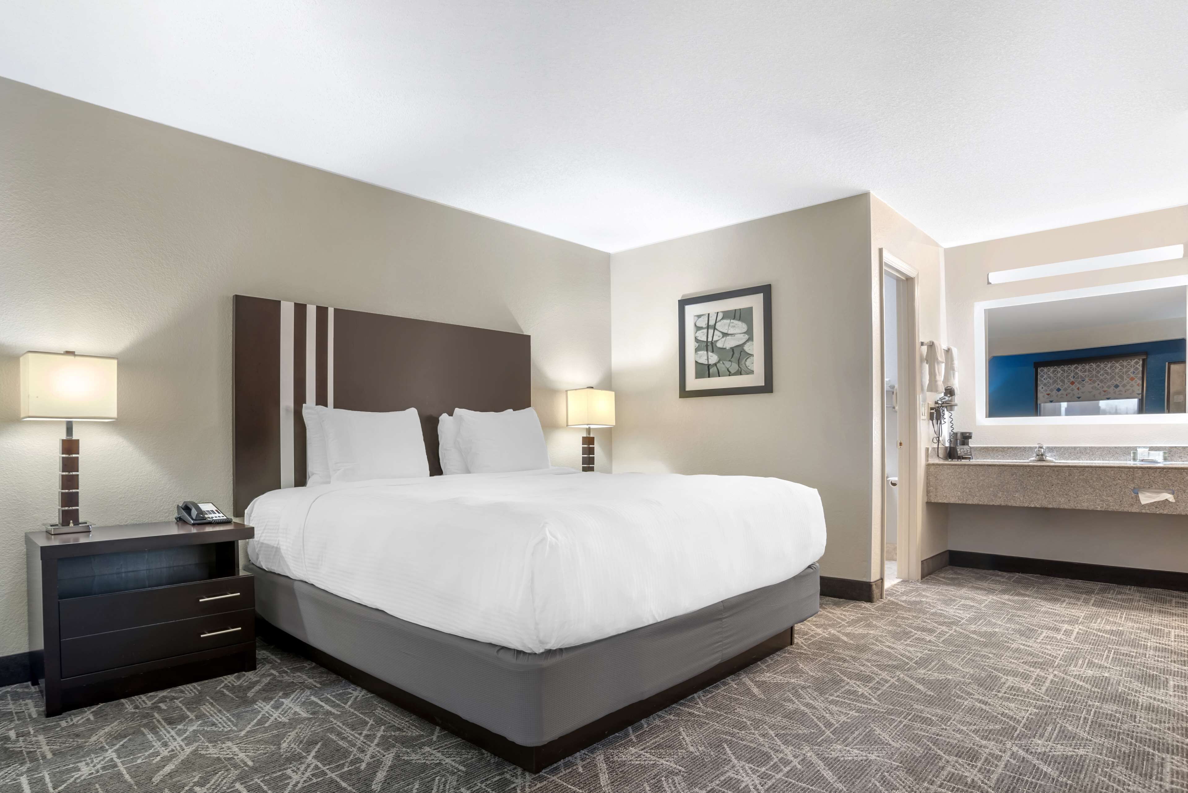 suite, 1 king bed, non smoking, refrigerator & microwave | pillow-top beds, desk, laptop workspace, iron/ironing board