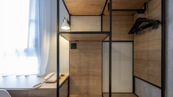 Premium bedding, desk, laptop workspace, blackout drapes