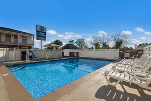Seasonal outdoor pool, open 8:00 AM to 10:00 PM, pool umbrellas