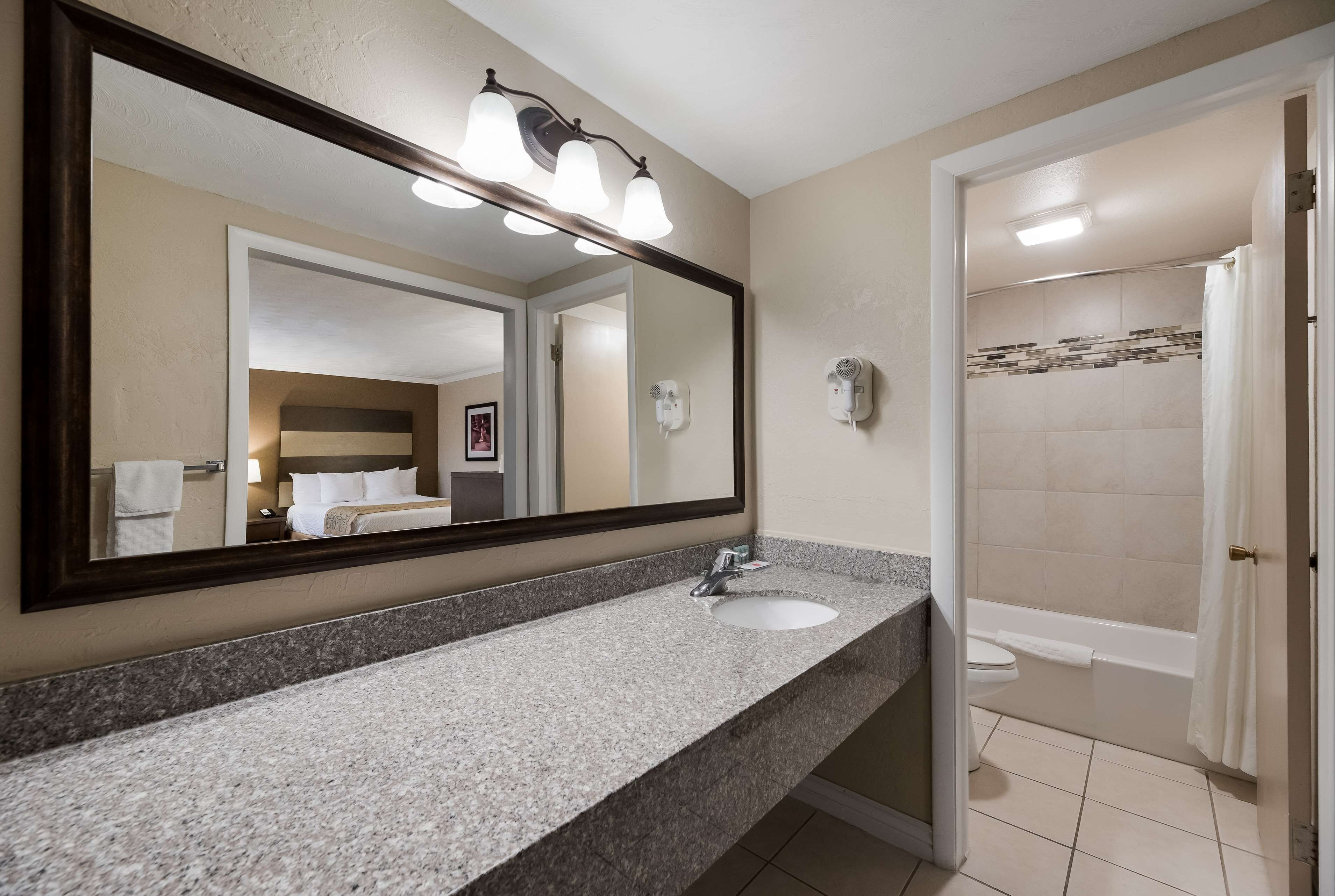standard room, 2 queen beds, non smoking | bathroom | combined shower/bathtub, hair dryer, towels