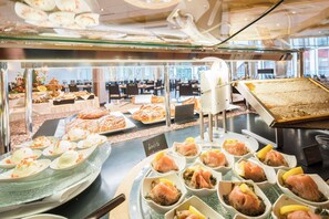 Indulge in a variety of international cuisine at our self-service buffet.