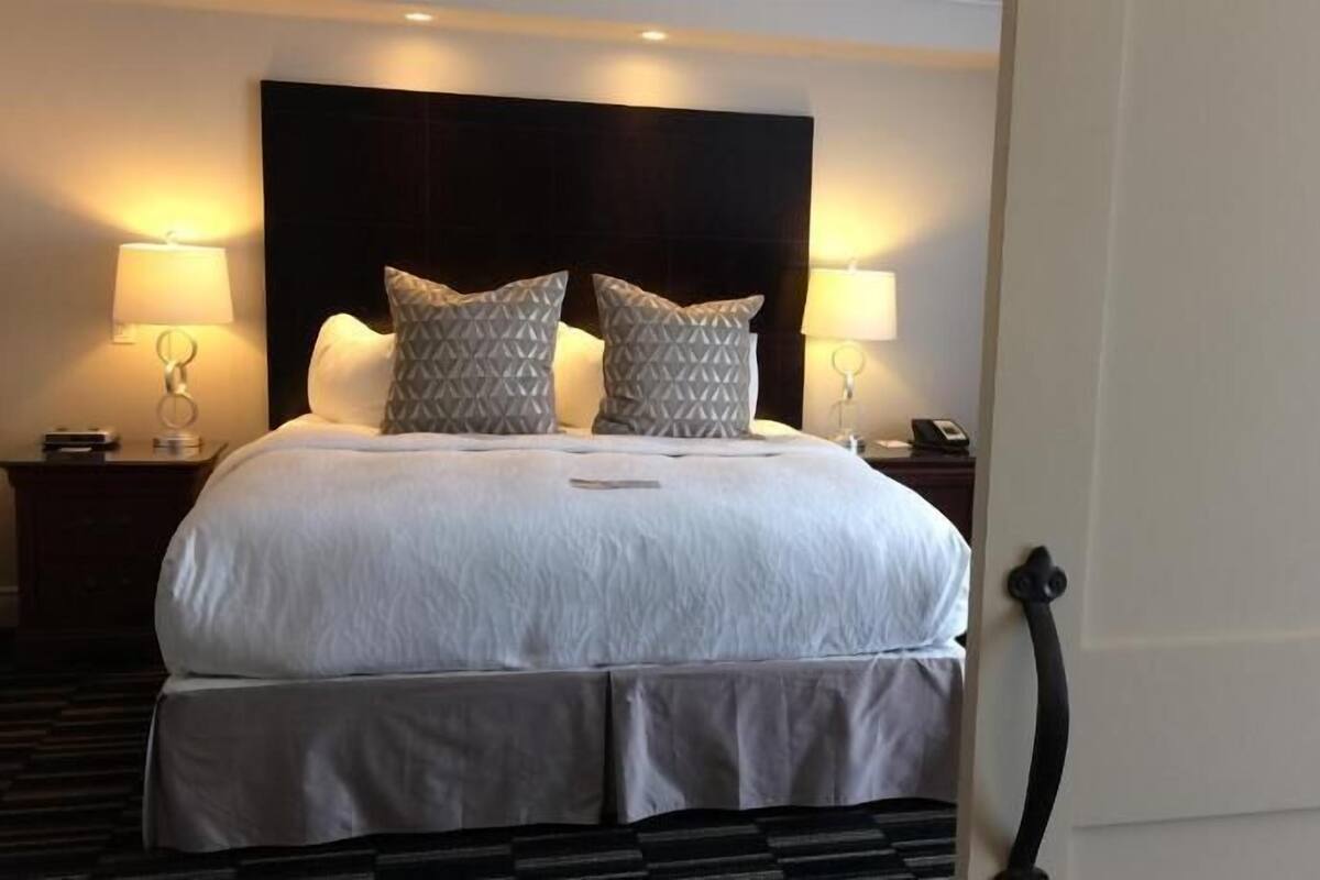 Hypo-allergenic bedding, desk, blackout drapes, iron/ironing board