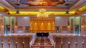 A formal event space with rows of chairs, a large chandelier, and a carpeted floor. - Sonesta Hotel Tower & Casino Cairo (Cairo)