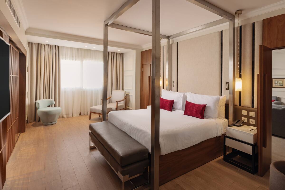 Deluxe Suite, City View | Select Comfort beds, minibar, in-room safe, desk