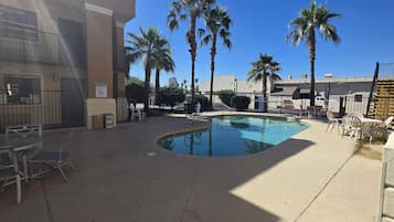 Outdoor pool, open 8:00 AM to 10 PM, pool loungers