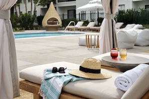 Outdoor pool, open 7:00 AM to 10:00 PM, free cabanas, pool umbrellas