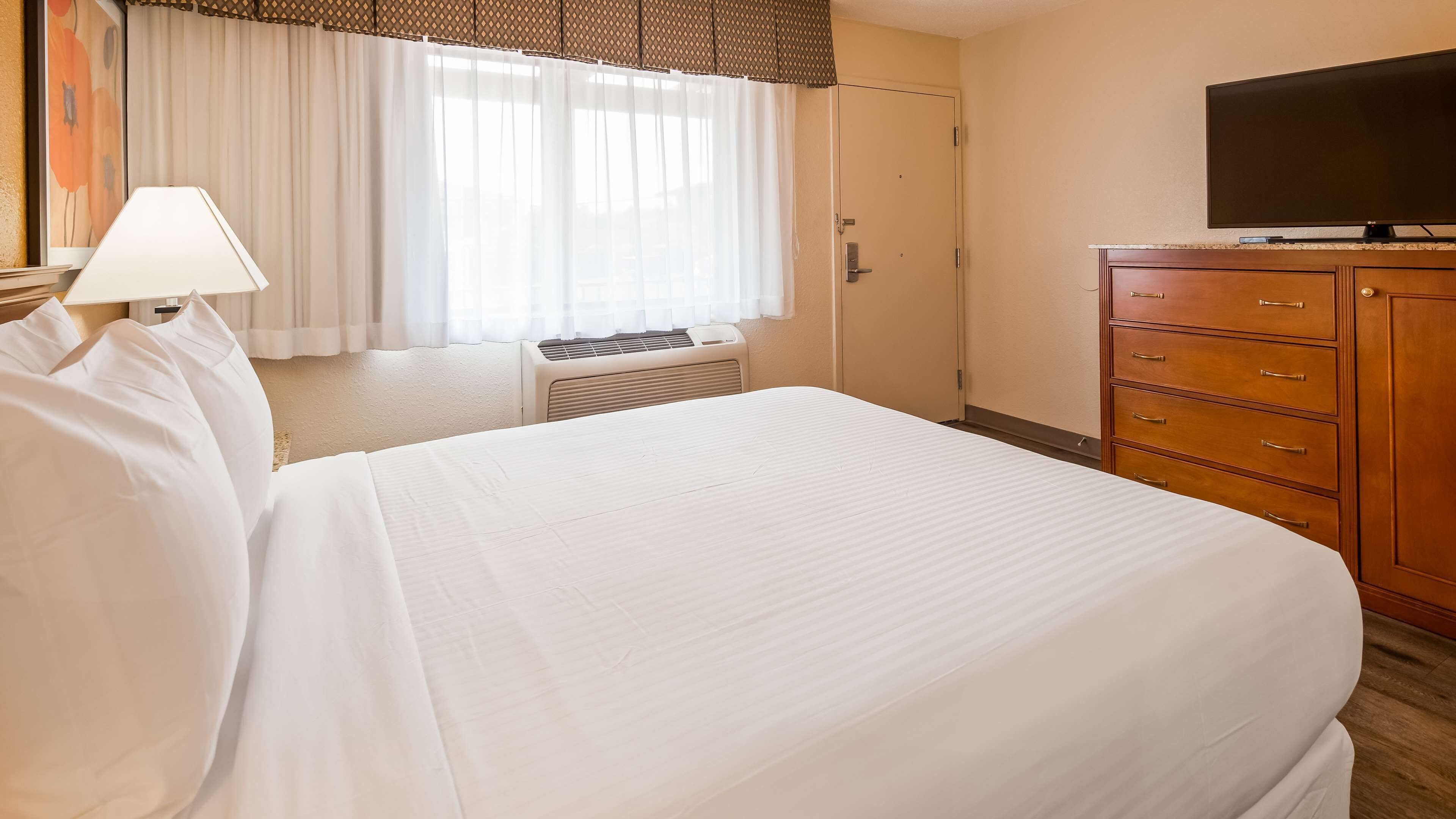 standard room, 1 king bed, non smoking, refrigerator & microwave | premium bedding, desk, laptop workspace, blackout curtains