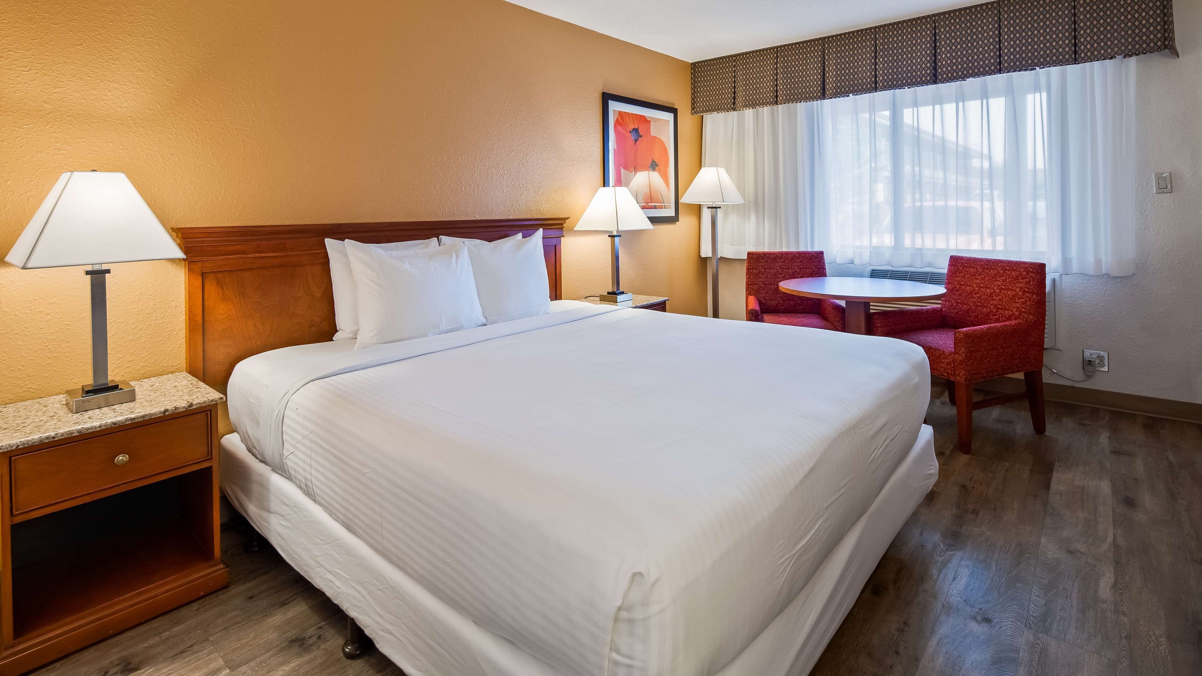 premium bedding, desk, laptop workspace, blackout curtains