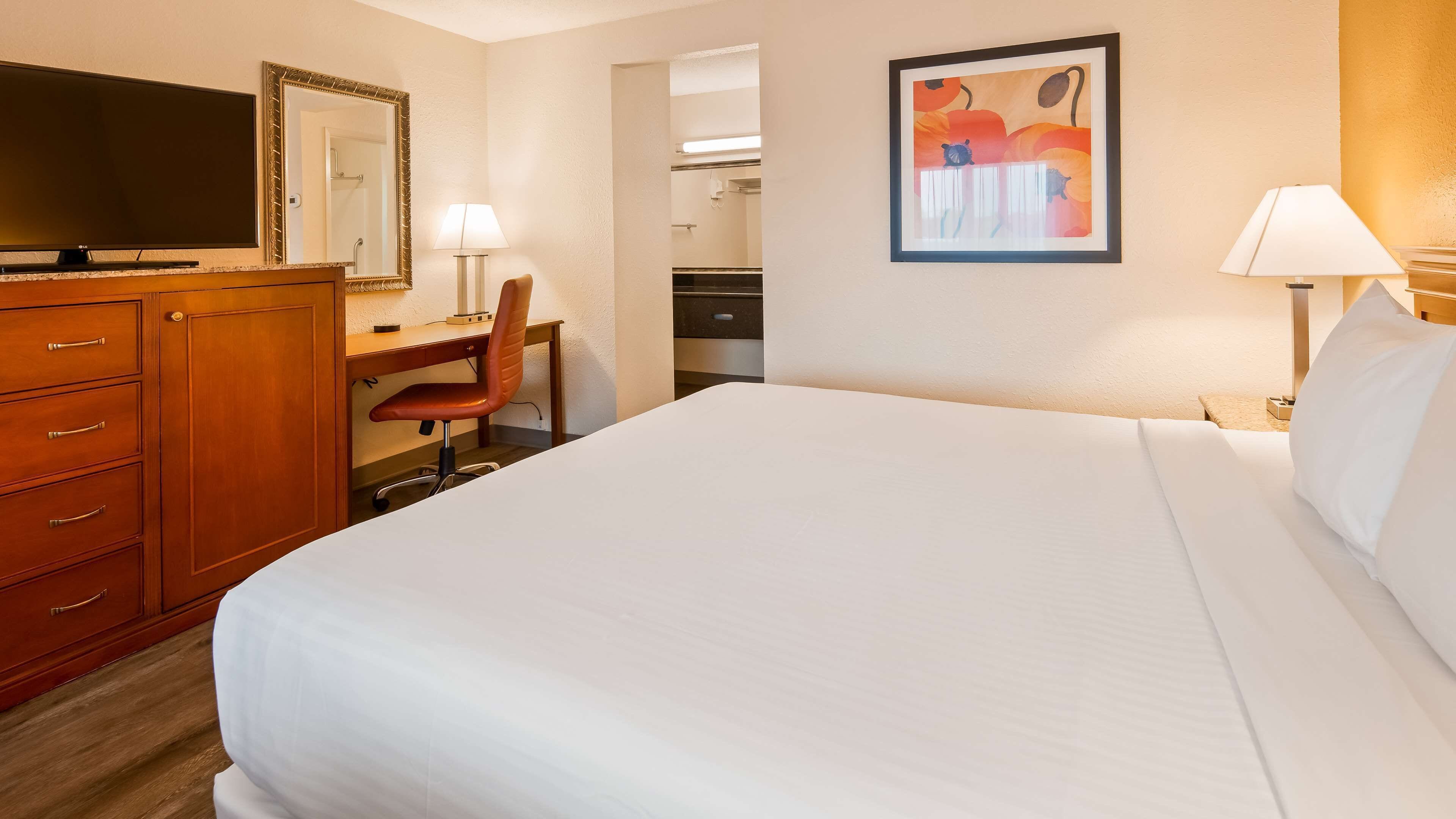 premium bedding, desk, laptop workspace, blackout curtains