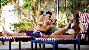 Outdoor pool, open 6:00 AM to 10:00 PM, sun loungers