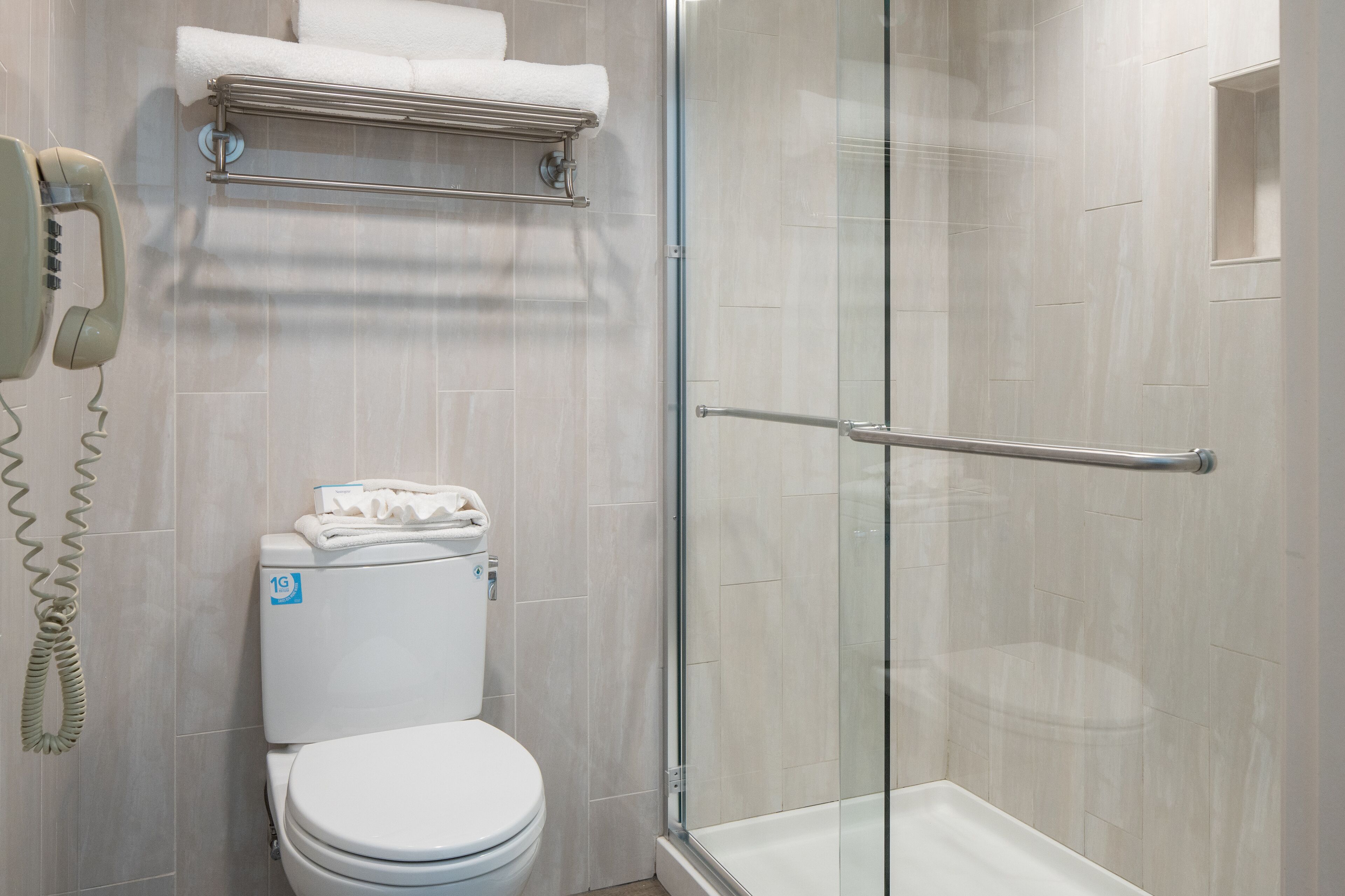 designer toiletries, hair dryer, towels, shampoo