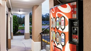 A vending machine with a variety of beverage options, including Coca-Cola, Sprite, and Fanta. - Red Roof Inn Indianapolis East (Indianapolis)