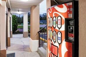 A vending machine with a variety of beverage options, including Coca-Cola, Sprite, and Fanta. - Red Roof Inn Indianapolis East (Indianapolis)