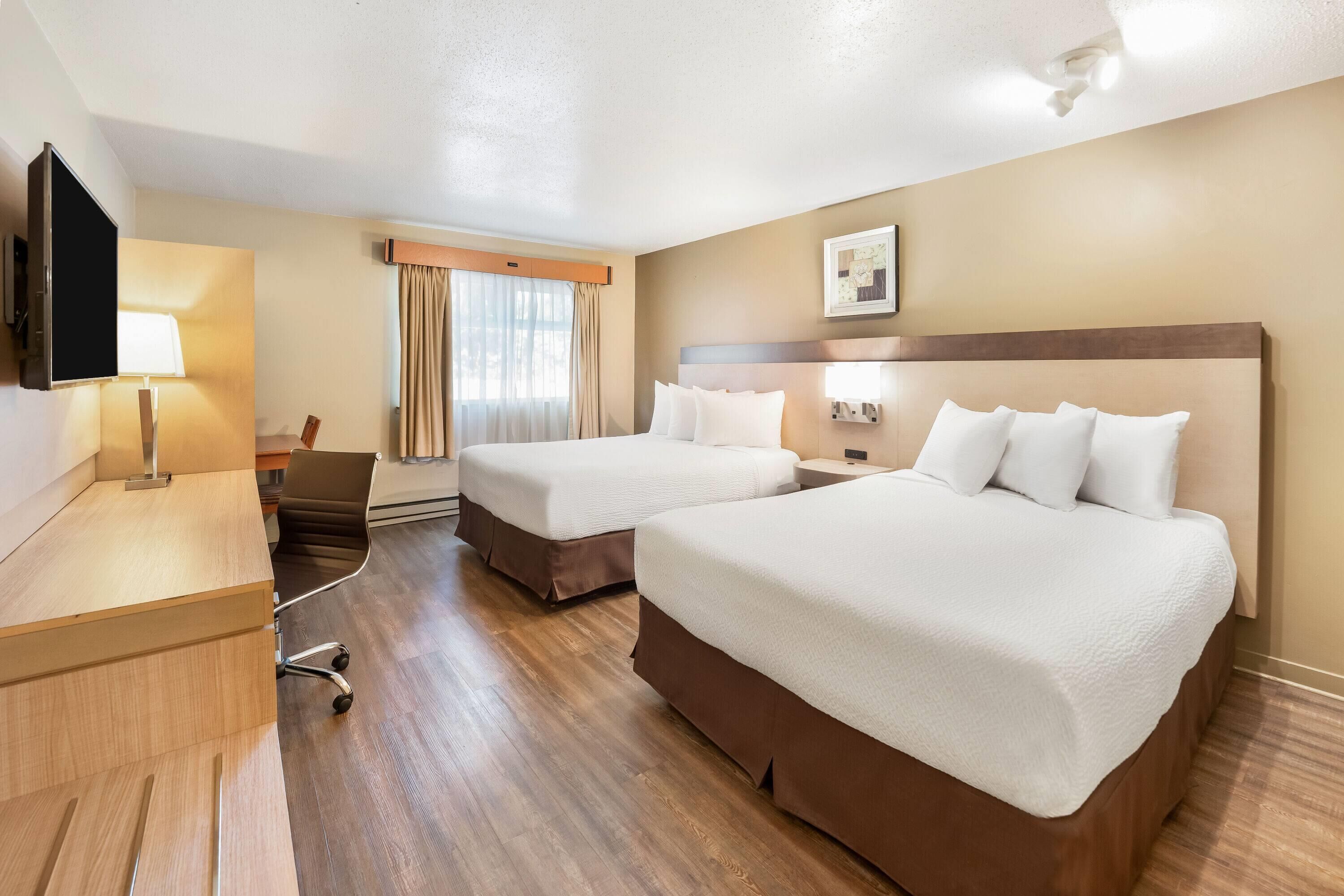 Room, 2 Queen Beds, Non Smoking (Pool Level, Pet-Friendly) | Desk, blackout drapes, iron/ironing board, free cribs/infant beds