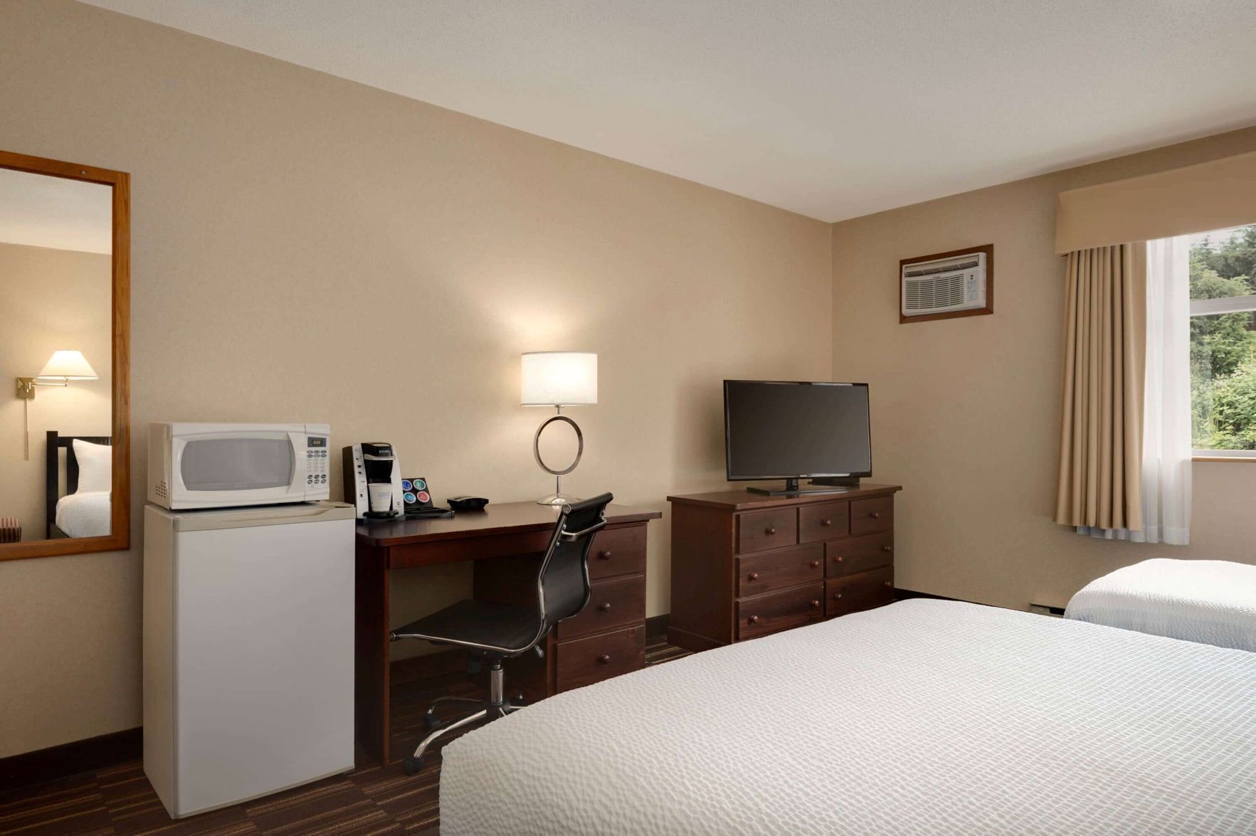 Desk, blackout drapes, iron/ironing board, free cribs/infant beds