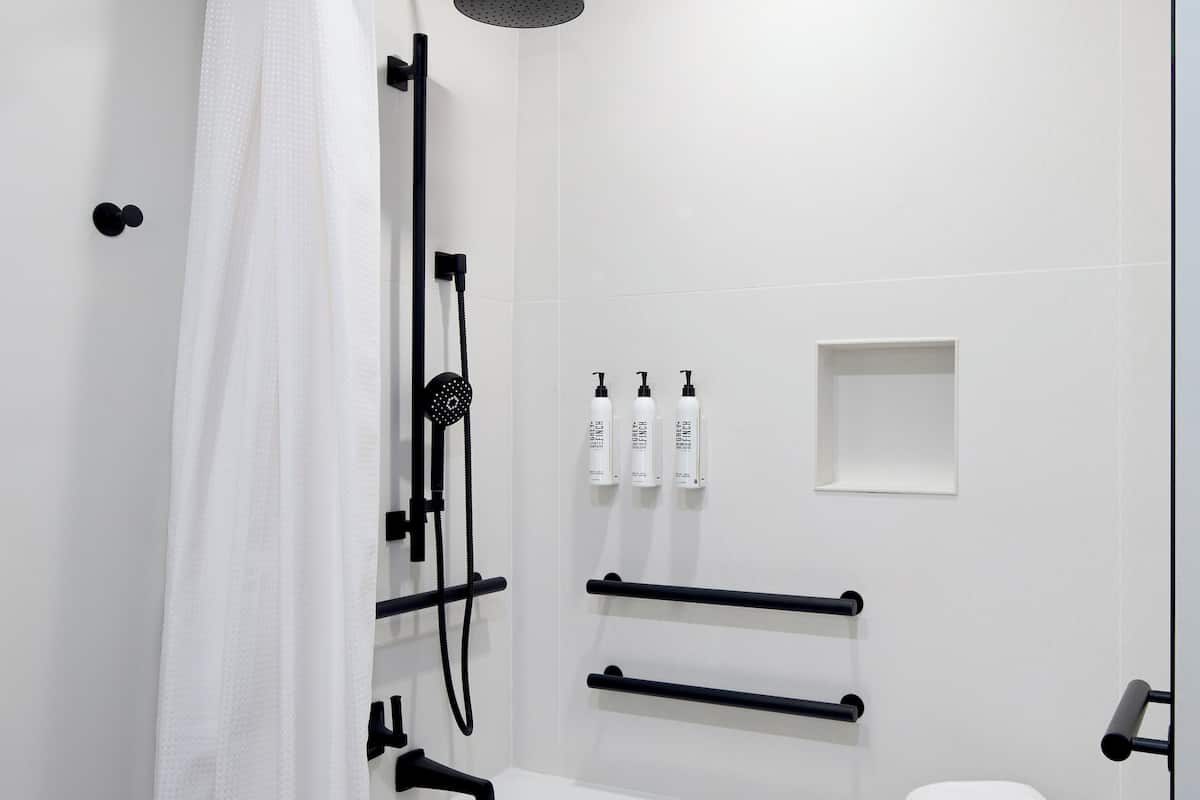 Room, 1 King Bed (Mobility Accessible w/ Tub) | Bathroom | Designer toiletries, hair dryer, bathrobes, towels