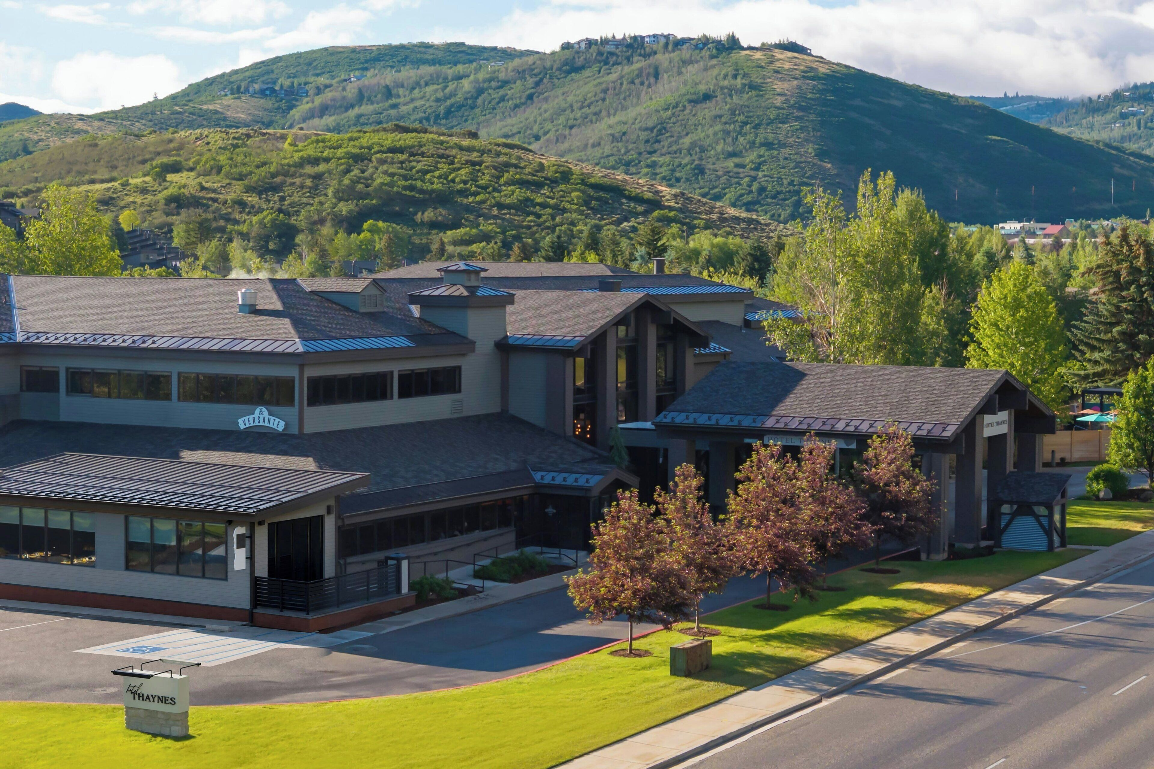 A hotel with a modern architectural style, featuring a flat roof and large windows.