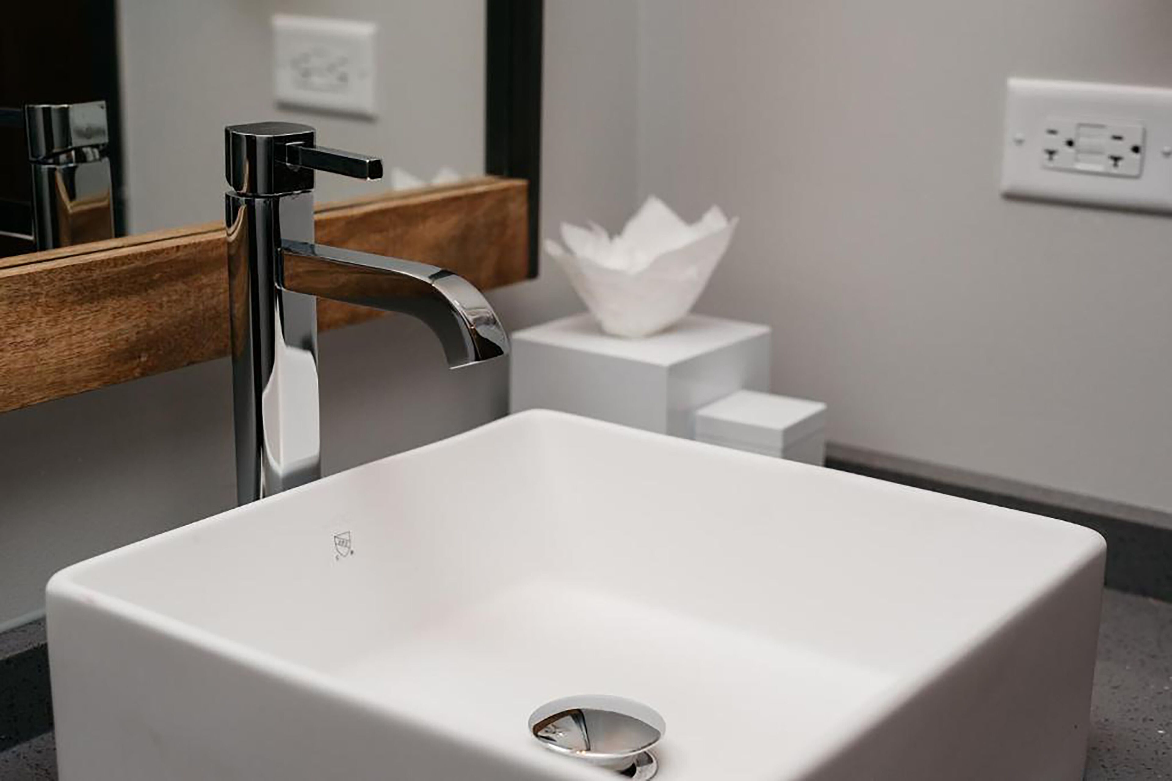 combined shower/bathtub, designer toiletries, hair dryer, bathrobes