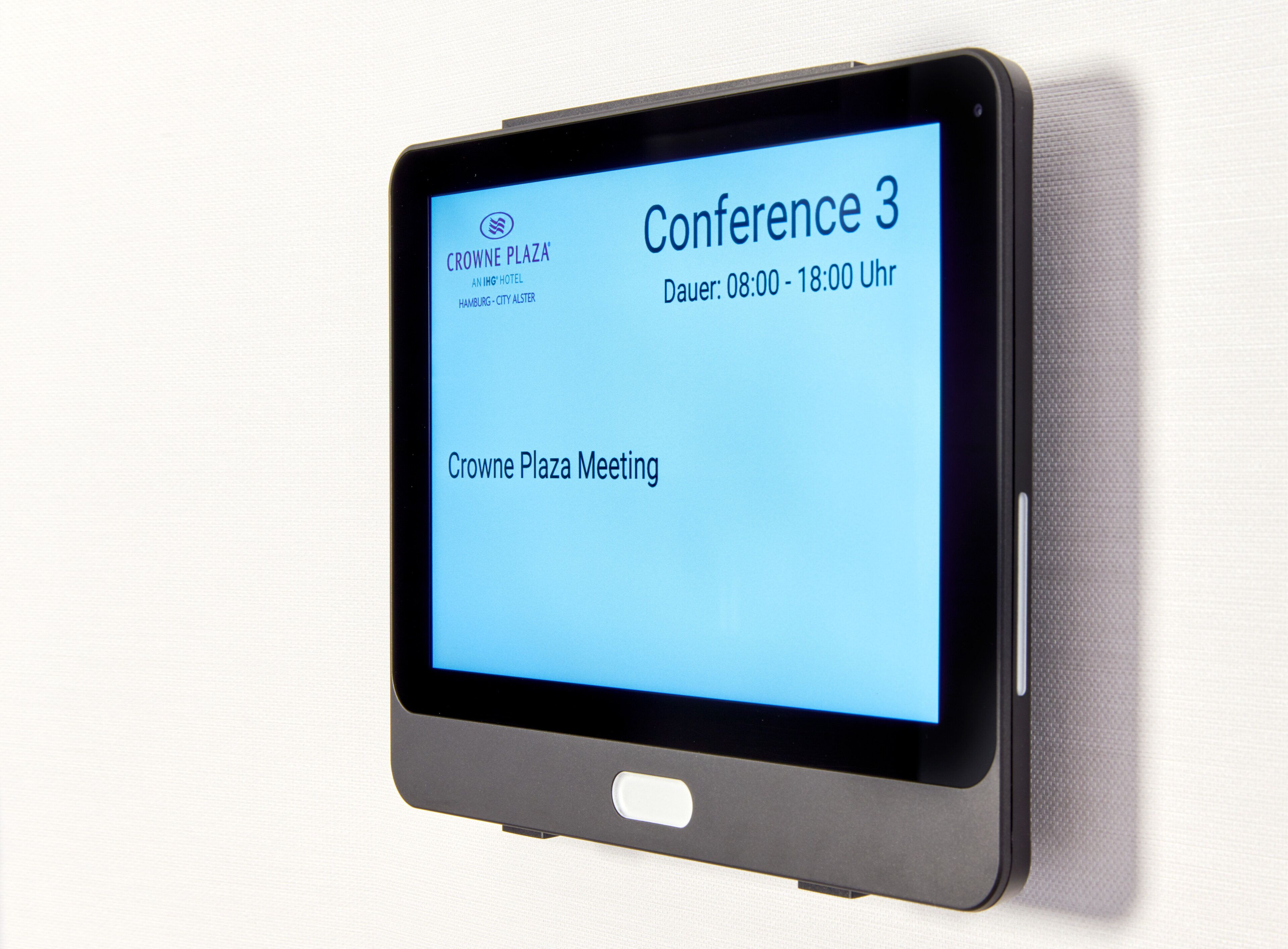 A tablet displaying information about a conference at Crowne Plaza.