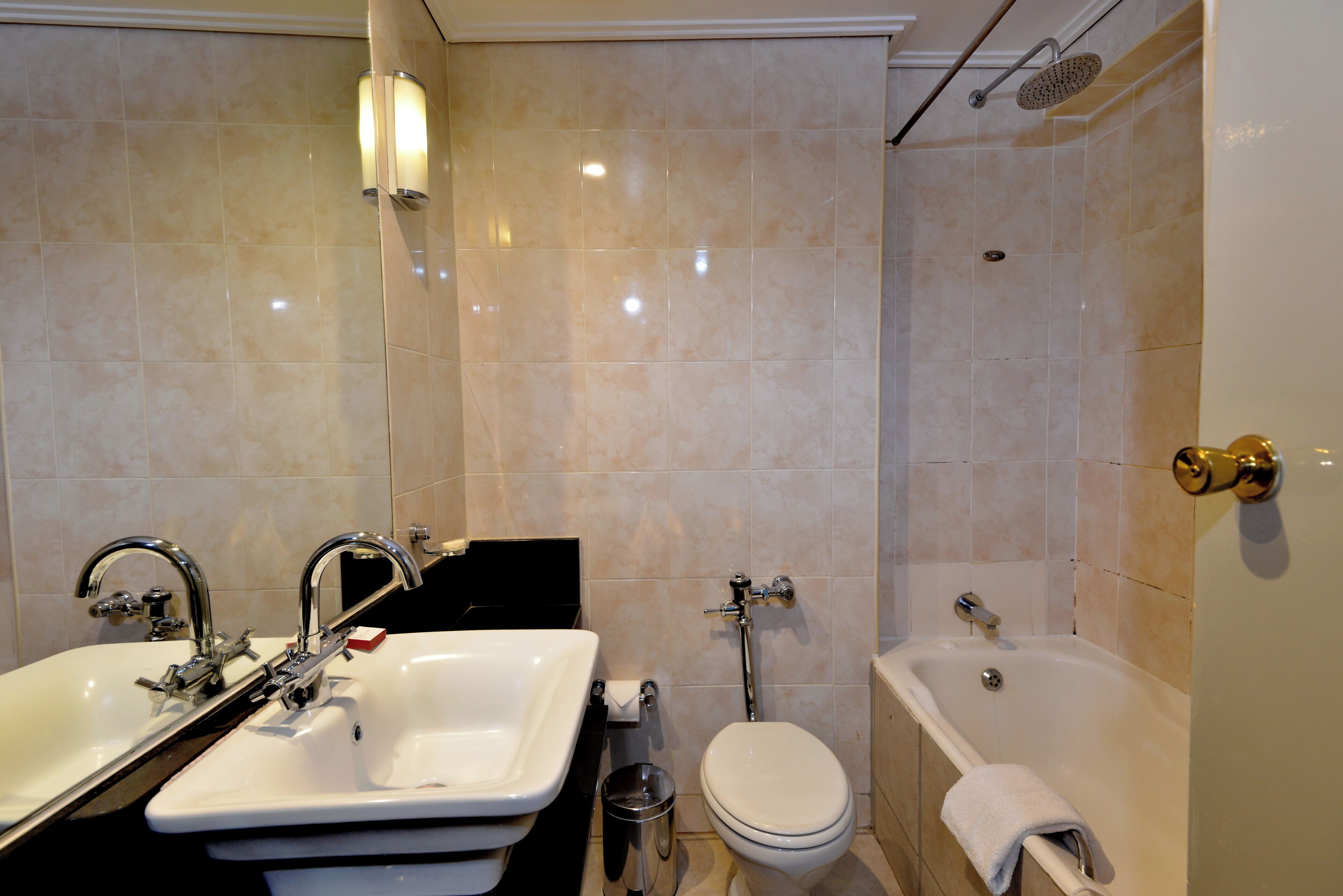 A bathroom with a sink, toilet, and bathtub.