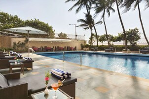 Outdoor pool, free pool cabanas, pool umbrellas