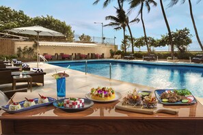 Outdoor pool, free cabanas, pool umbrellas
