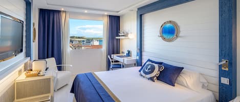 Deluxe Room, Sea View | Minibar, in-room safe, desk, laptop workspace