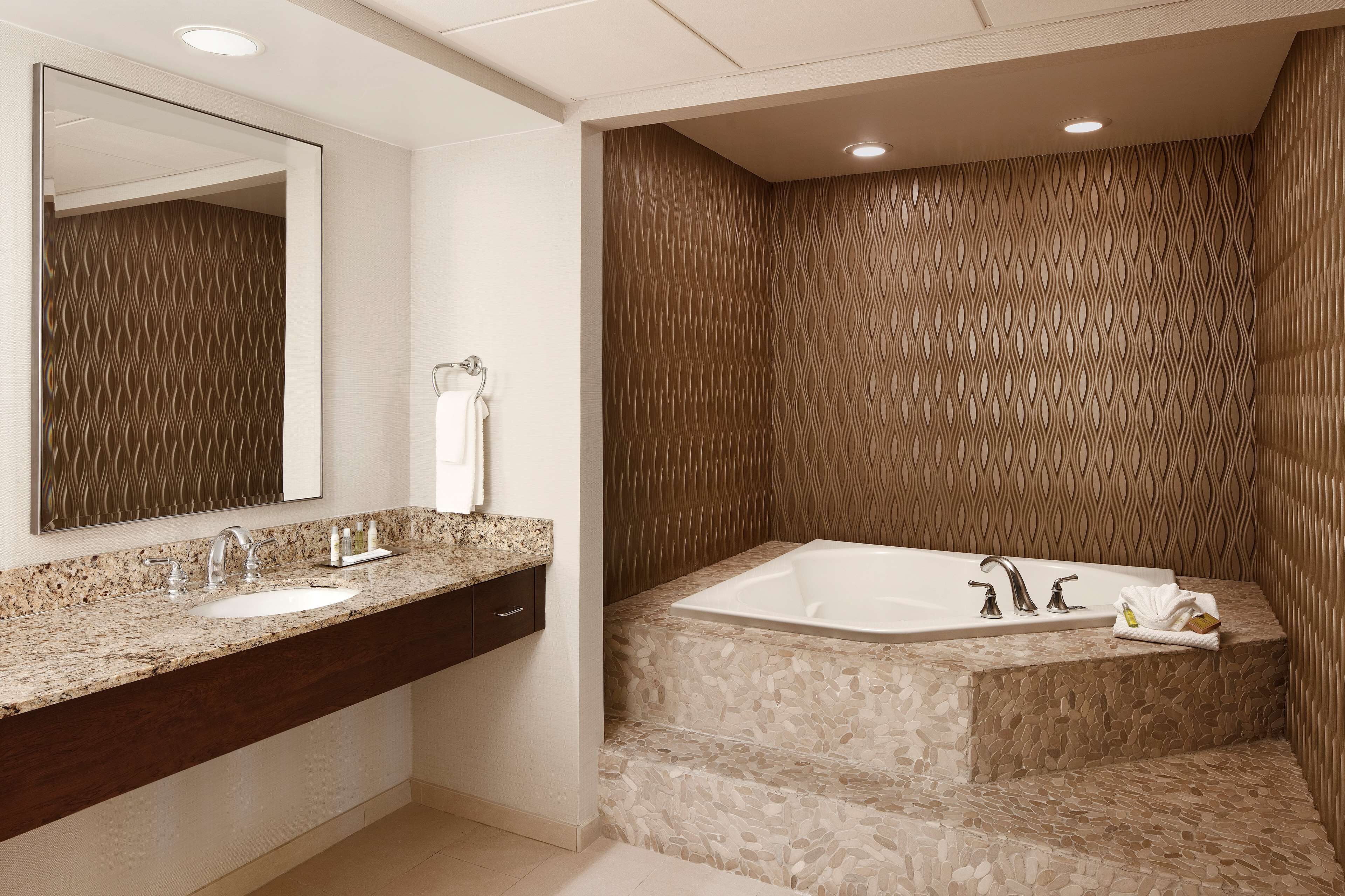 presidential suite, 1 king bed | bathroom | combined shower/bathtub, eco-friendly toiletries, hair dryer, towels
