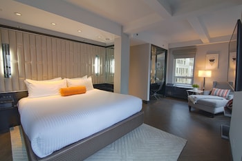 Premium bedding, down comforters, pillowtop beds, in-room safe at Hotel Edison Times Square