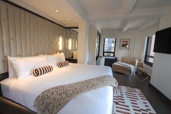 Premium bedding, down comforters, pillowtop beds, in-room safe at Hotel Edison Times Square