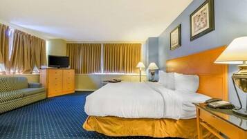 Premium bedding, desk, laptop workspace, blackout drapes