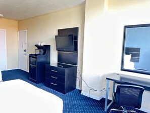 Premium bedding, desk, laptop workspace, blackout drapes