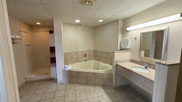 Suite, 1 King Bed with Sofa bed, Non Smoking, Jetted Tub | Bathroom | Combined shower/tub, free toiletries, hair dryer, towels