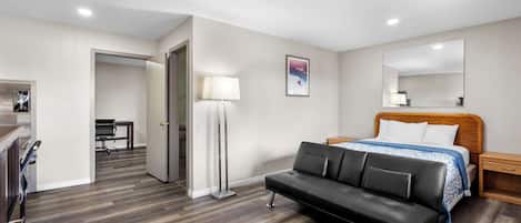Suite, 1 King Bed with Sofa bed, Non Smoking | Desk, laptop workspace, blackout curtains, iron/ironing board