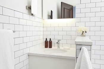 Combined shower/tub, hydromassage showerhead, designer toiletries at The Gregorian