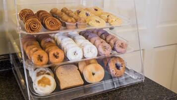 A bakery display case with various baked goods.