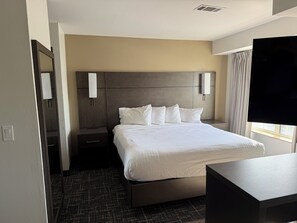 Premium bedding, desk, laptop workspace, iron/ironing board