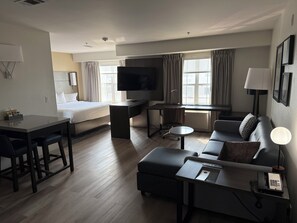 Premium bedding, desk, laptop workspace, iron/ironing board