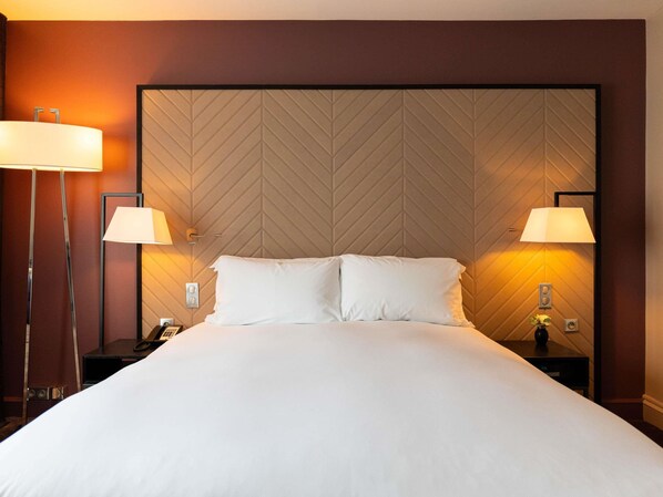Premium bedding, down comforters, pillowtop beds, minibar