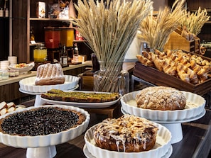 A buffet with various baked goods and desserts. - Sofitel Strasbourg Grande Ile (Strasbourg)