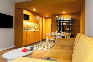 TRIBE Apartment, 1 Double Bed | Living area | 32-inch LCD TV with satellite channels, TV - TRIBE Hotel Den Haag Centraal - Opened December 2025 (The Hague)