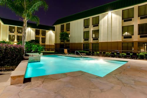 Outdoor pool, open 7:00 AM to 10:00 PM, pool umbrellas, pool loungers