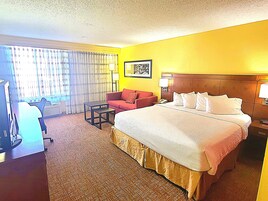 Hypo-allergenic bedding, desk, laptop workspace, blackout curtains